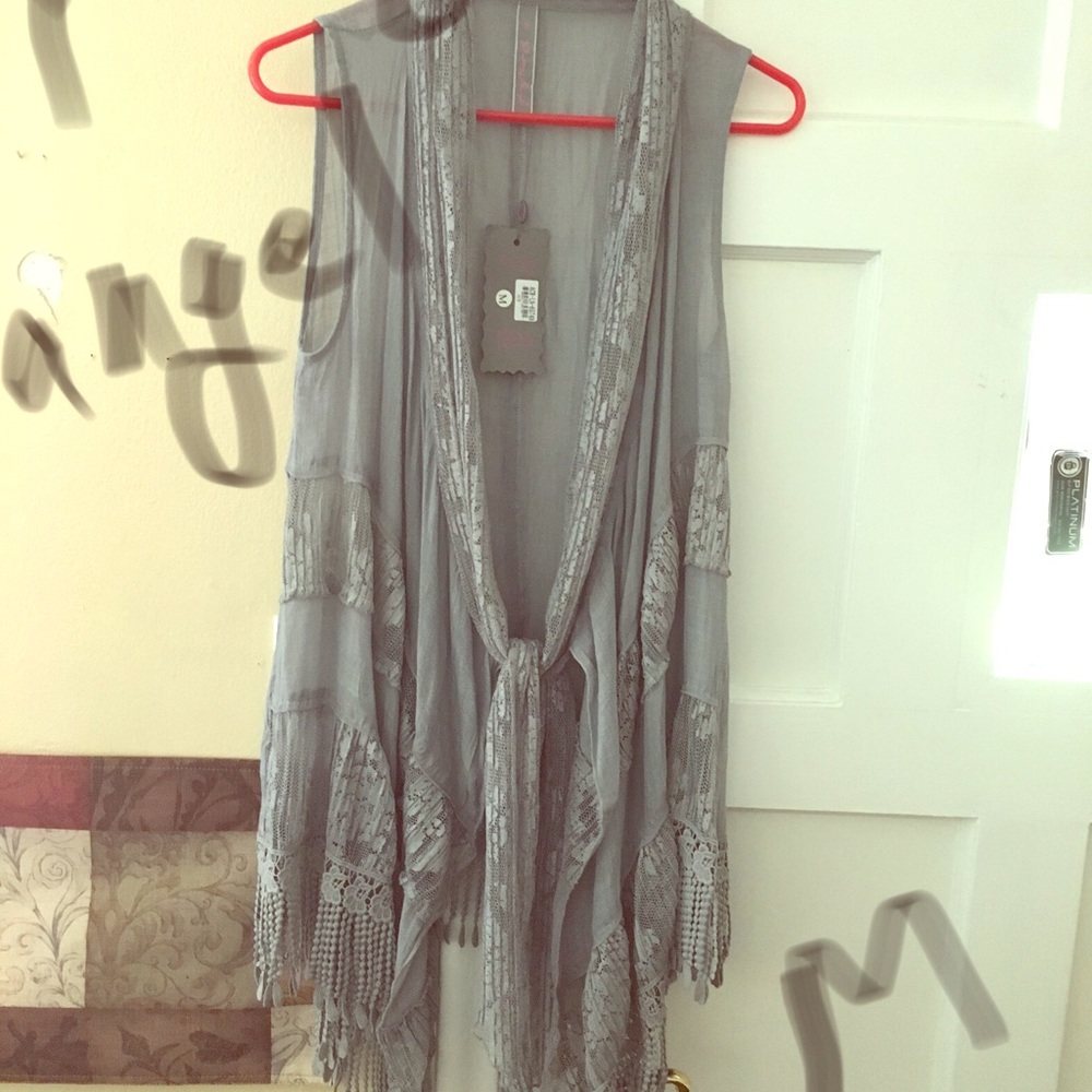 Pretty Angel brand lace vest.